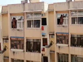 Viral Video Anything for Diwali ! Woman cleans fourth floor window by standing on the window itself