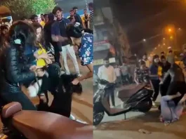 Viral Video Shocker ! Four Indore girls beat up another girl at a busy road in night