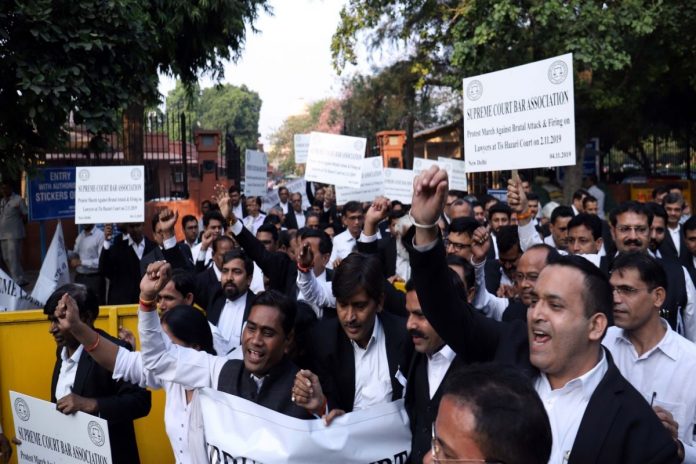 New Delhi: Advocates of Supreme Court under the banner of Supreme Court Bar Association, participate in a march to protest against brutal attack and firing on lawyers at Tis Hazari Court on Saturday; in New Delhi on Nov 4, 2019. (Photo: IANS)