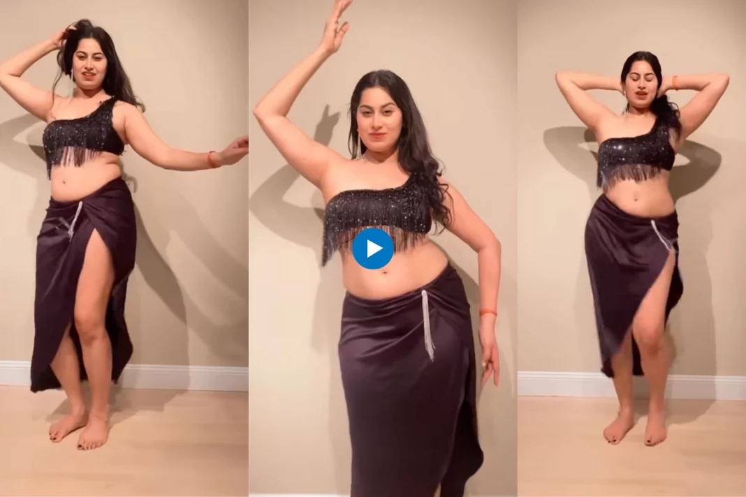 The video features the talented belly dancer Shreya, gracefully grooving in a scintillating black outfit that accentuates her every move
