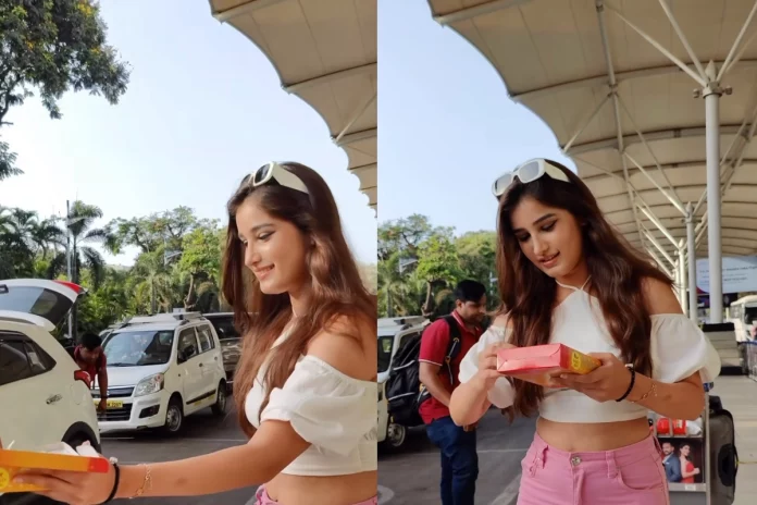 rashatandon Rasha Tandon, daughter of Raveena Tandon, delighted the paparazzi at Mumbai's airport as she fulfilled her promise of bringing sweets for them