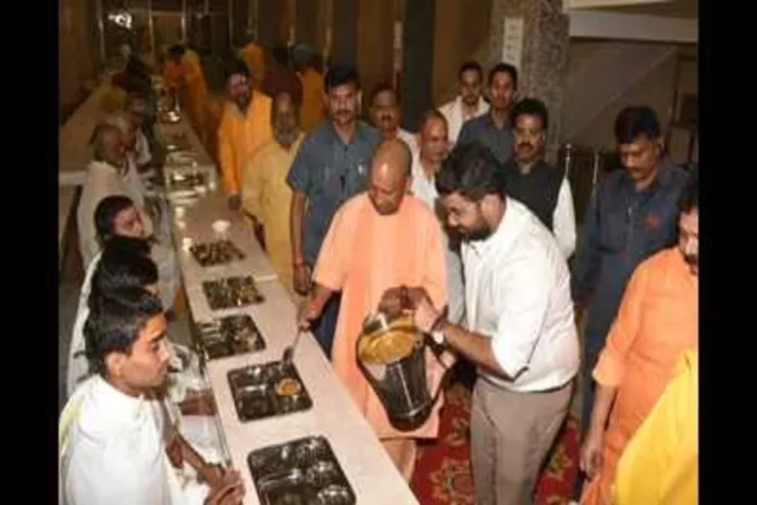 U-P--CM-Yogi-Adityanath-serving-food-at-Shri-Hanum_1698770651695