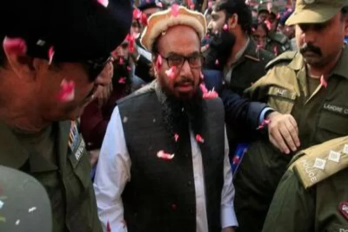 FILE-PHOTO--Hafiz-Saeed-is-showered-with-flower-pe_1703865051542
