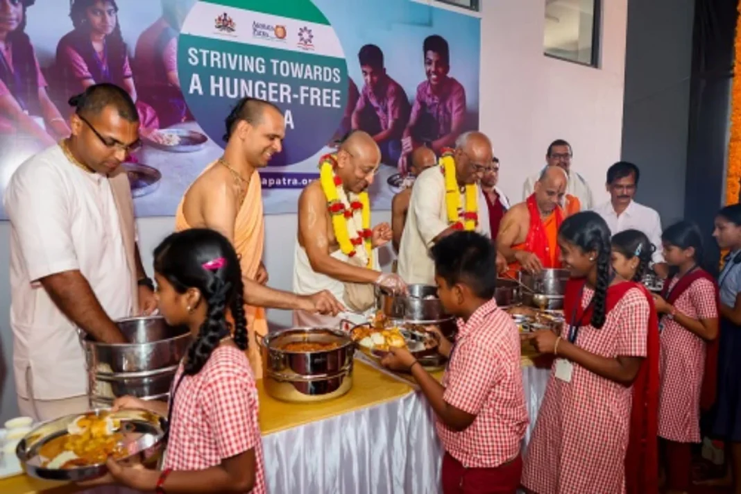 The Akshaya Patra Foundation feeding mid-day meals to students in the newly launched kitchen