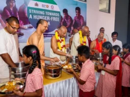 The Akshaya Patra Foundation feeding mid-day meals to students in the newly launched kitchen